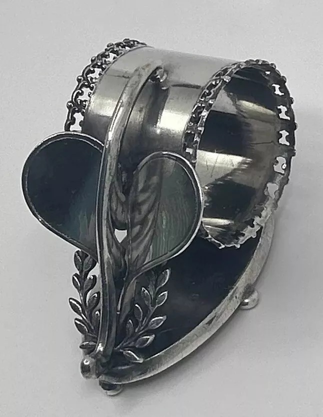Meriden B Company 658. This figual napkin ring has squash racquts. Some people think it is a heart.