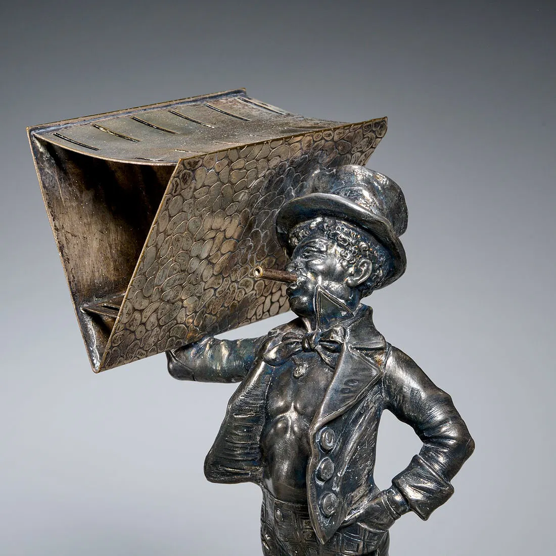 This is an amazing WMF figural toothpick holder, which consists of a negro waiter carrying food.
